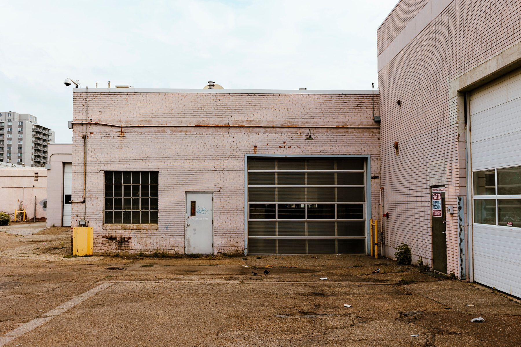 Industrial building with a roll-up door and parking yard